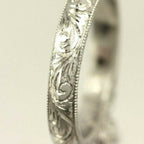 Platinum engagement ring cathedral semi mount lotus engraved diamond accents