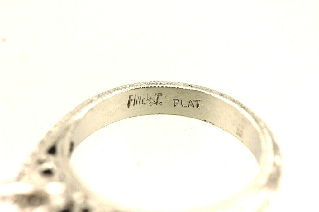 Platinum engagement ring cathedral semi mount lotus engraved diamond accents