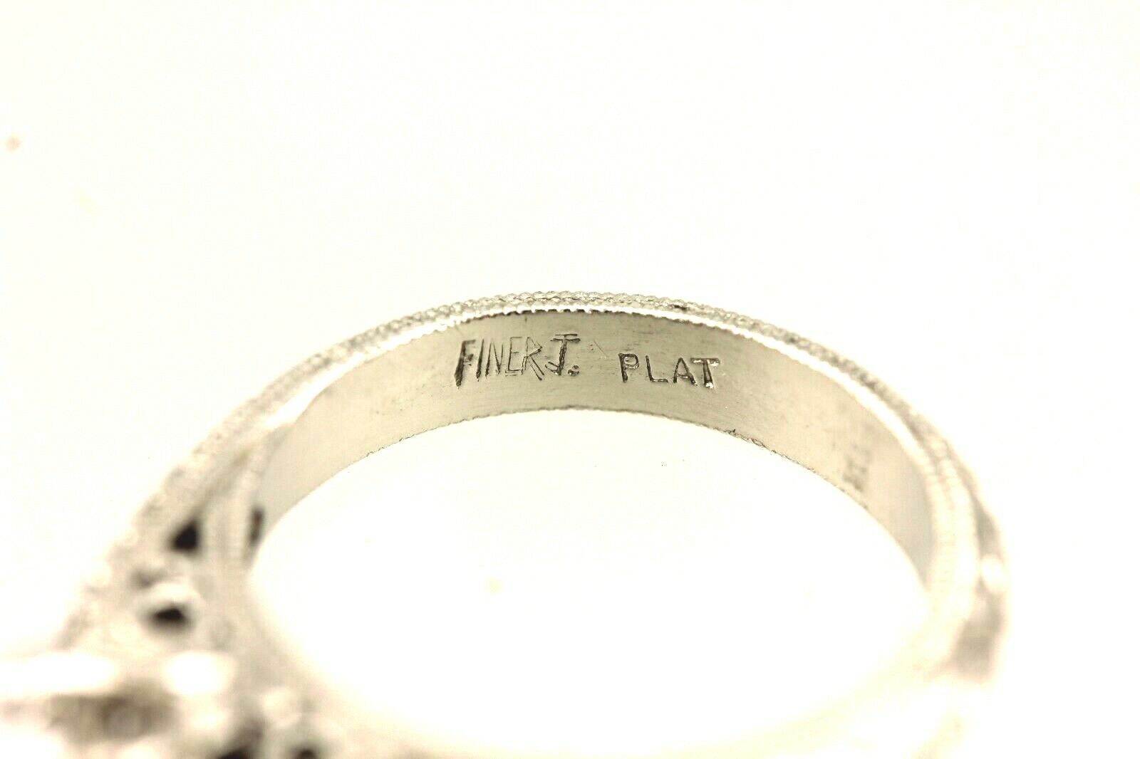 Platinum engagement ring cathedral semi mount lotus engraved diamond accents